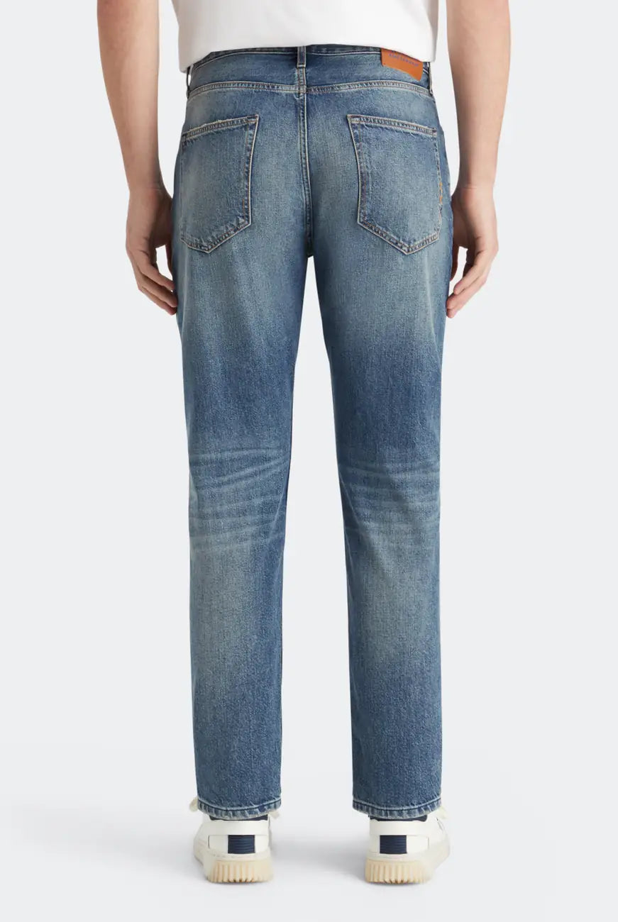 Loose Tapered Jeans detail shot showing fabric and craftsmanship by Scotch & Soda