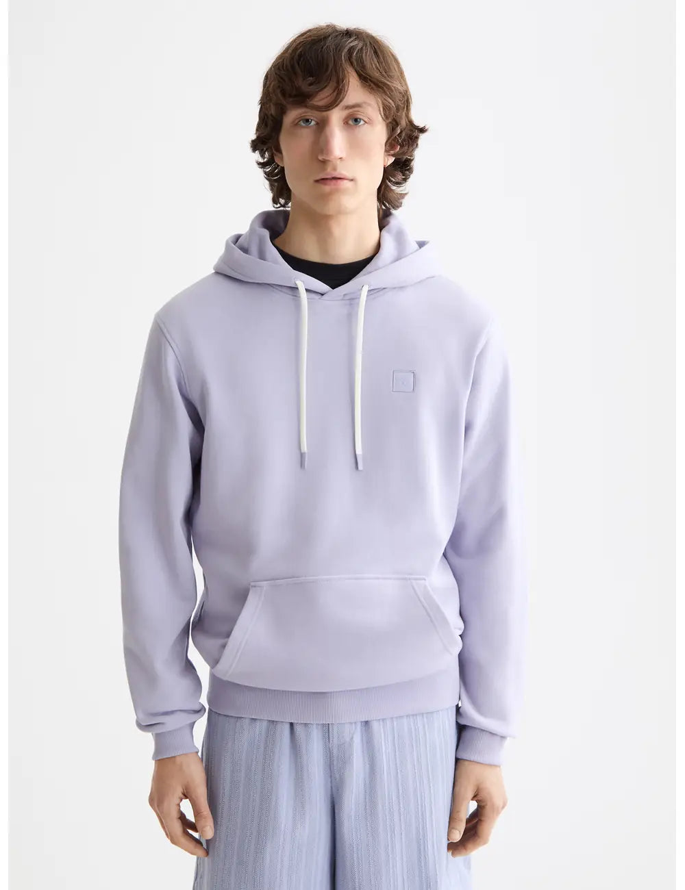 Logo Badge Hoodie close-up on model showing fit and detail by Scotch & Soda