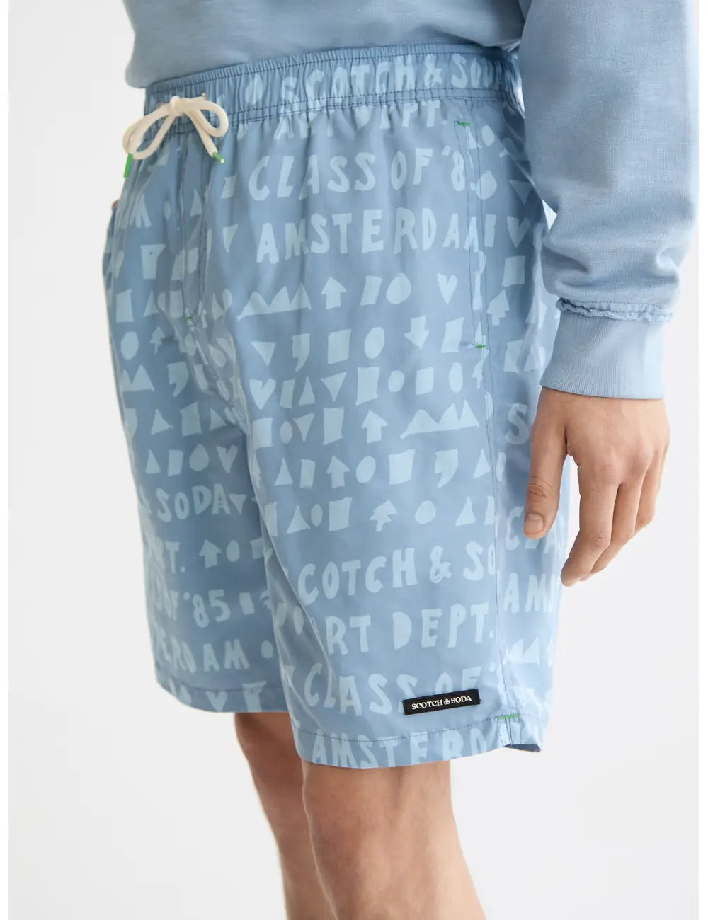 Printed Swim Shorts close-up on model showing fit and detail by Scotch & Soda