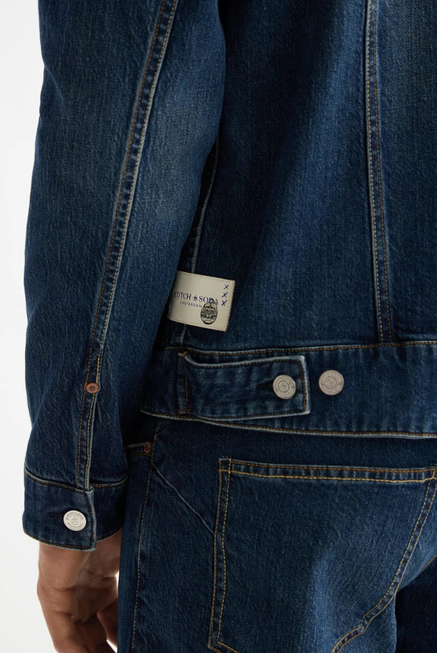 denim-trucker-jacket-let-it-rain-750-years-celebration detail shot by Scotch & Soda
