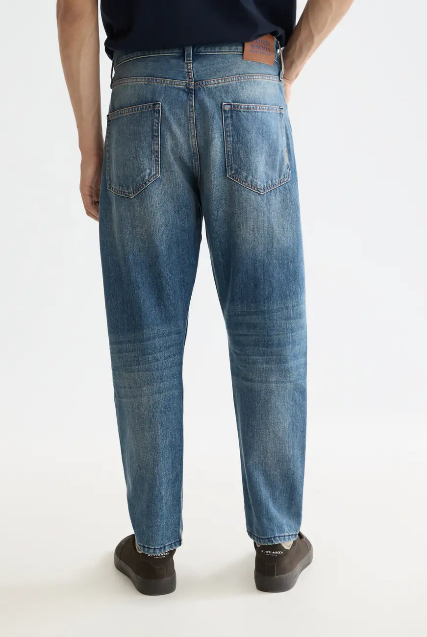 Loose Tapered Jean detail shot showing fabric and craftsmanship by Scotch & Soda