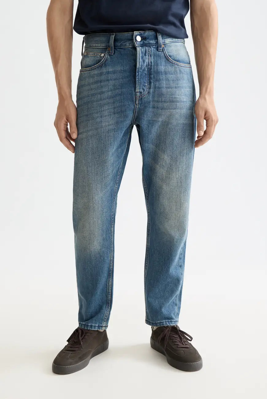 Loose Tapered Jean close-up on model showing fit and detail by Scotch & Soda