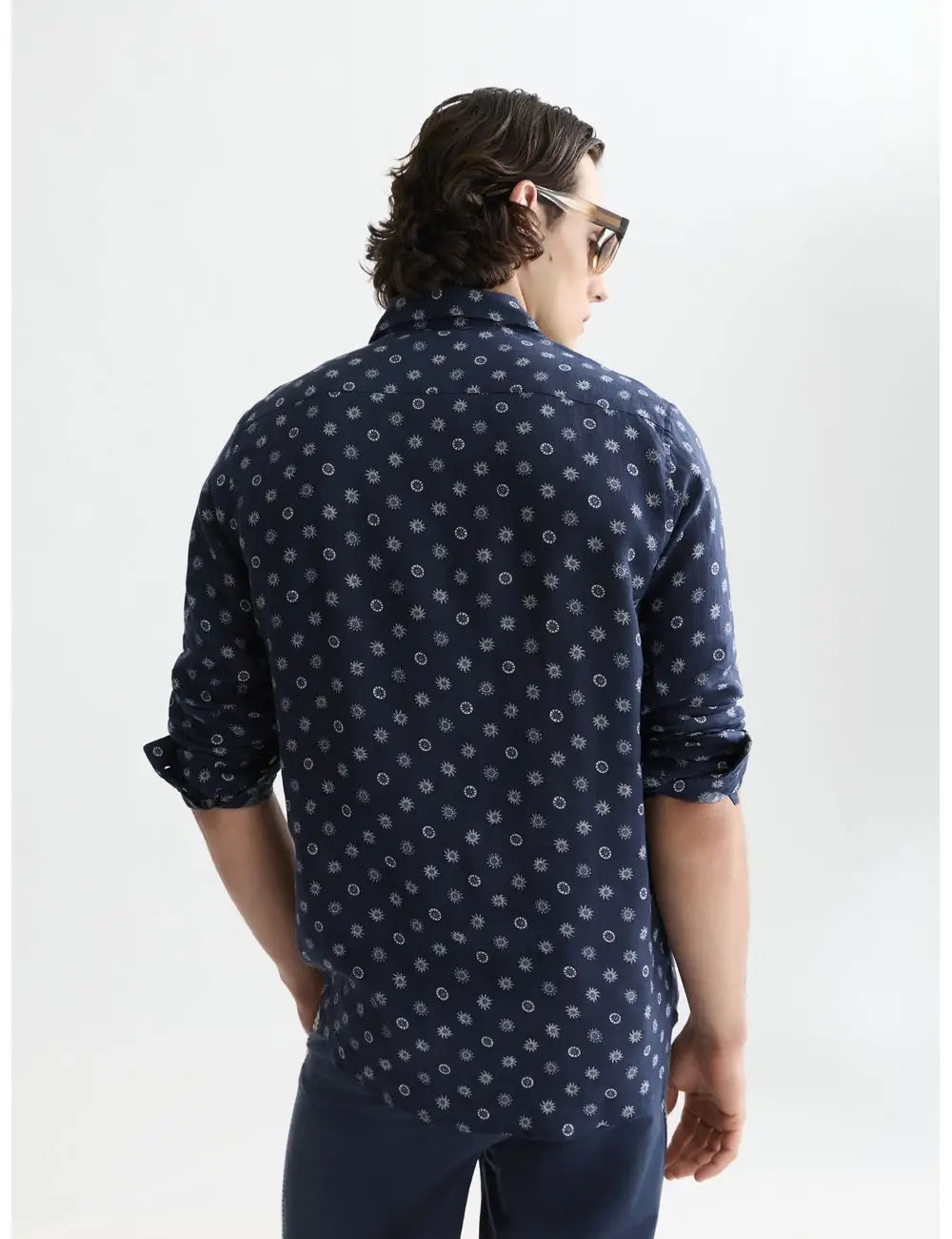 Man wearing a navy blue patterned shirt on a white background by Scotch & Soda
