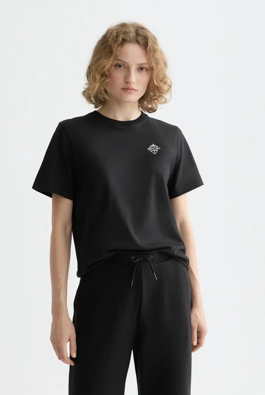 Black Core Chest Artwork Regular T-shirt close-up on model by Scotch & Soda