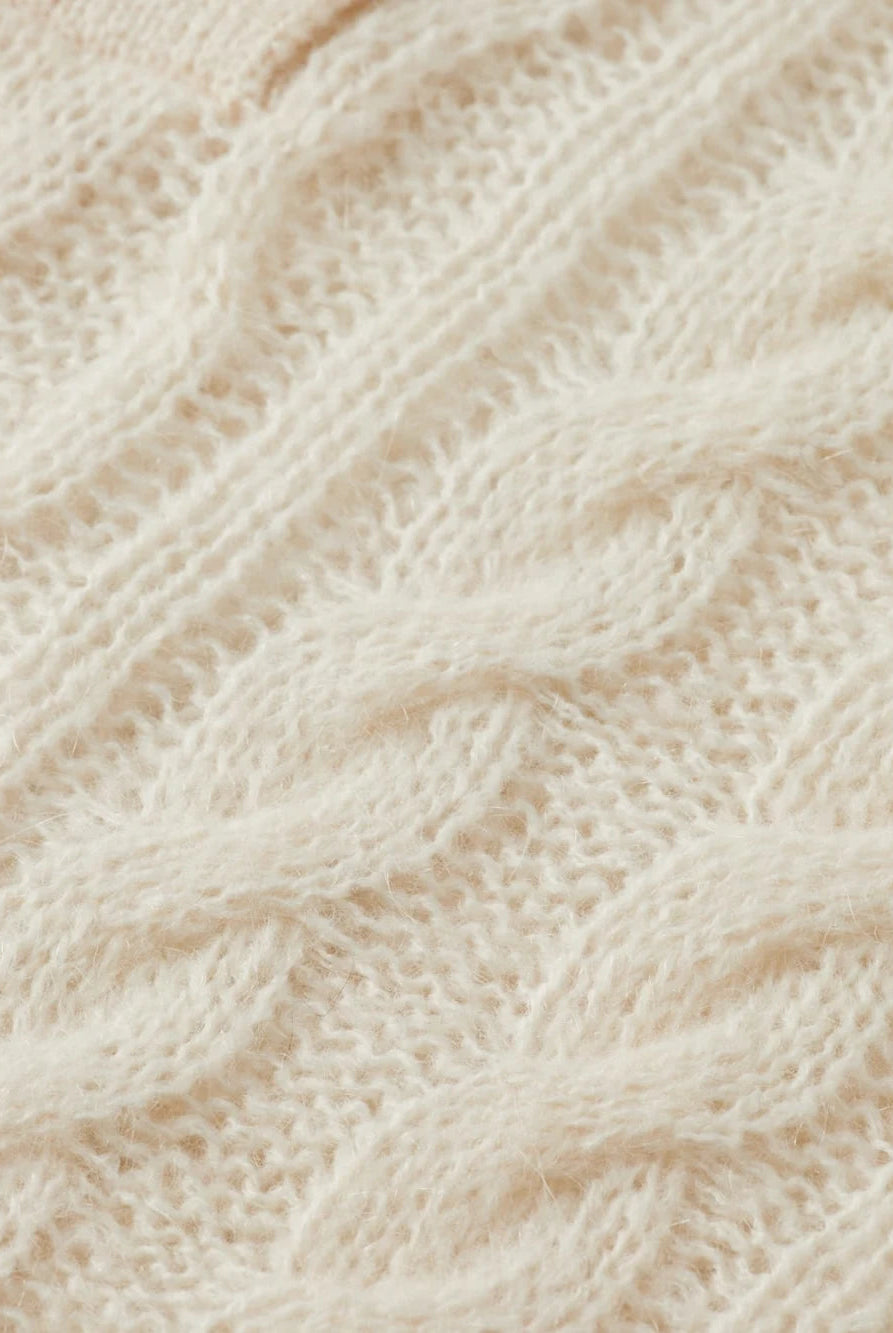 cable-stitch-polo-neck-pullover detail shot by Scotch & Soda