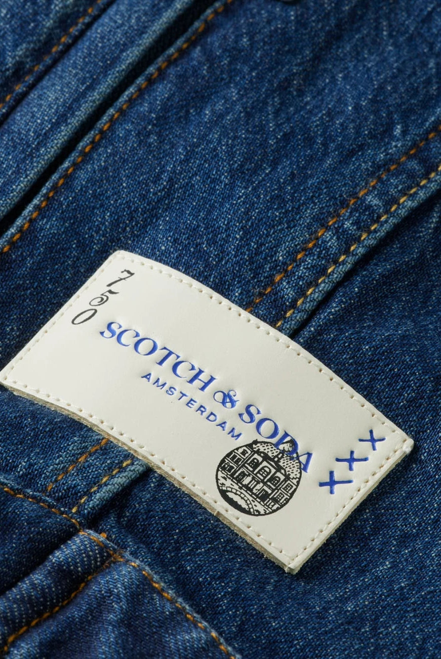 cropped-denim-jacket-let-it-rain-750-year-celebration detail shot by Scotch & Soda