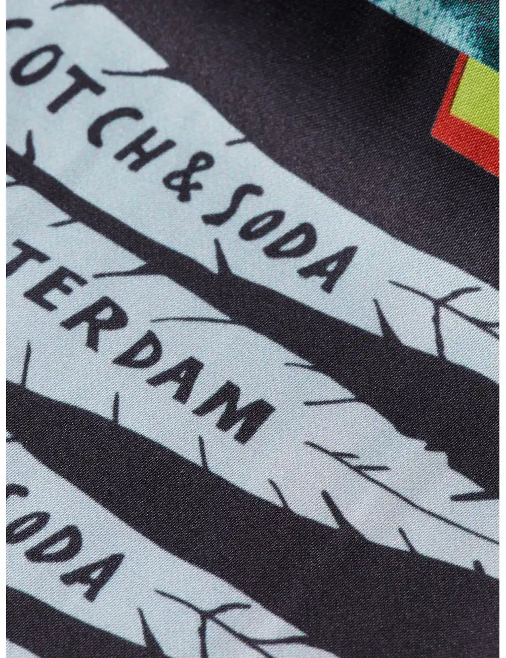Close-up of fabric texture with branding.