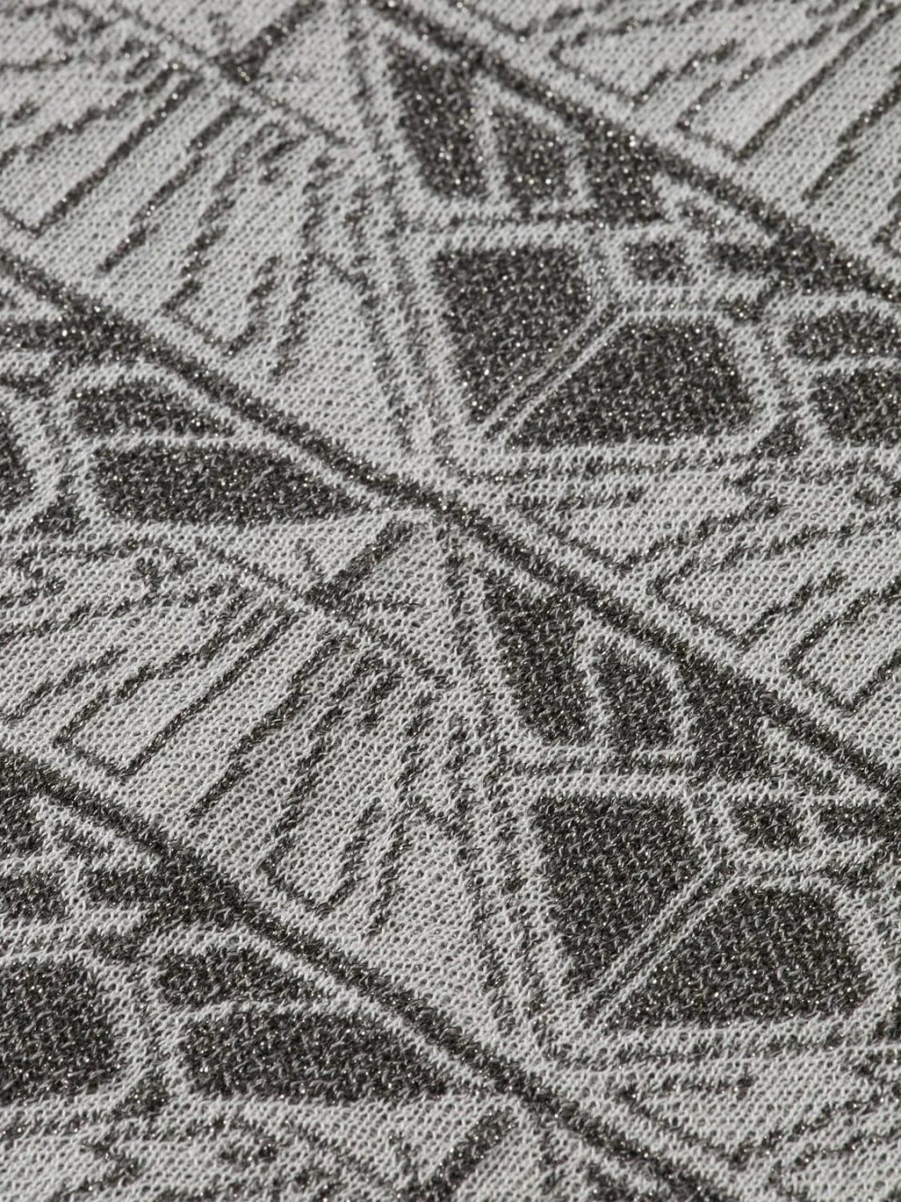 monogram-jacquard-knitted-trousers detail shot by Scotch & Soda