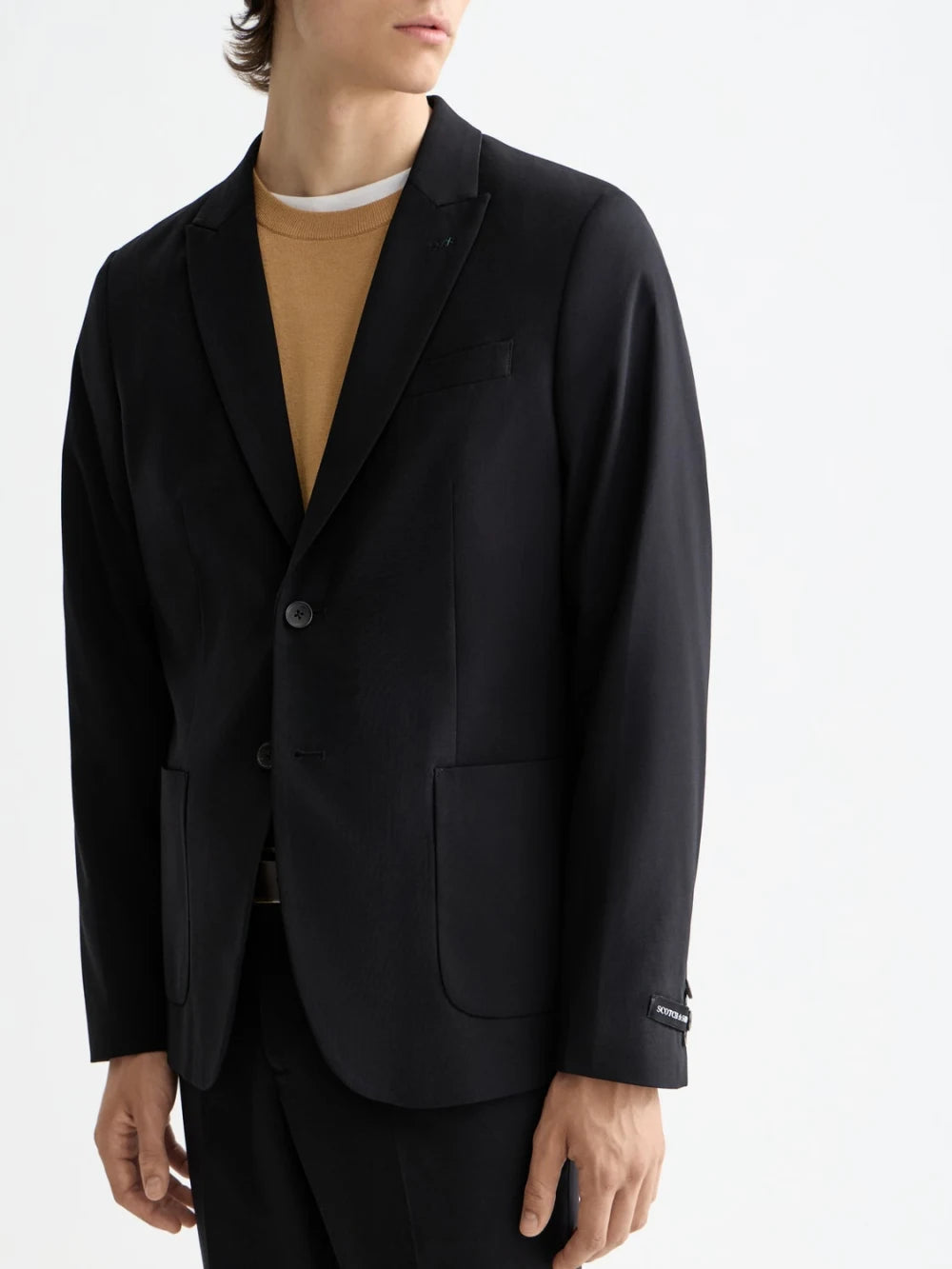 core-unconstructed-peak-lapel-cool-wool-blazer-black detail shot by Scotch & Soda