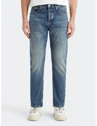 Loose Tapered Jeans close-up on model showing fit and detail by Scotch & Soda