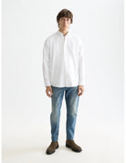 Oxford Solid Shirt full model shot showing overall fit by Scotch & Soda