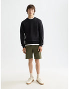 Logo Sweatshirt full model shot showing overall fit by Scotch & Soda