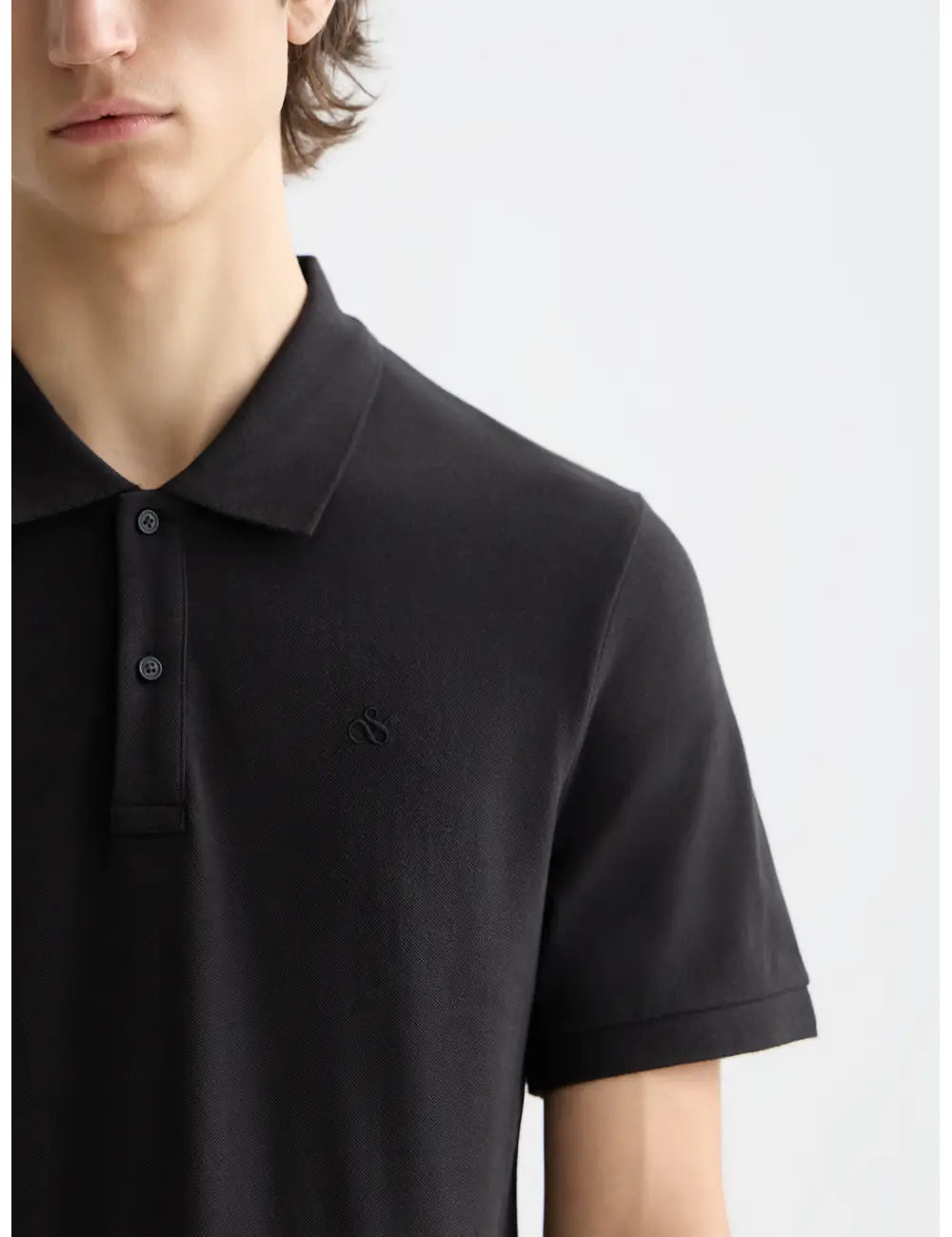 Logo Pique Polo detail shot showing fabric and craftsmanship by Scotch & Soda