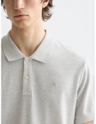 Core - Logo Pique Polo detail shot of fabric and craftsmanship by Scotch & Soda