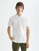 Logo Pique Polo close-up on model showing fit and detail by Scotch & Soda