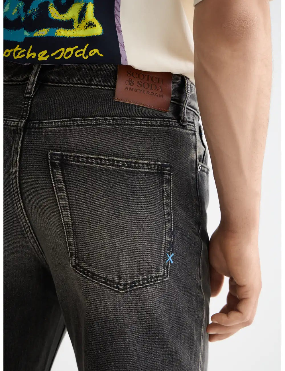 Beat Boot Cut Jeans detail shot showing fabric and craftsmanship by Scotch & Soda