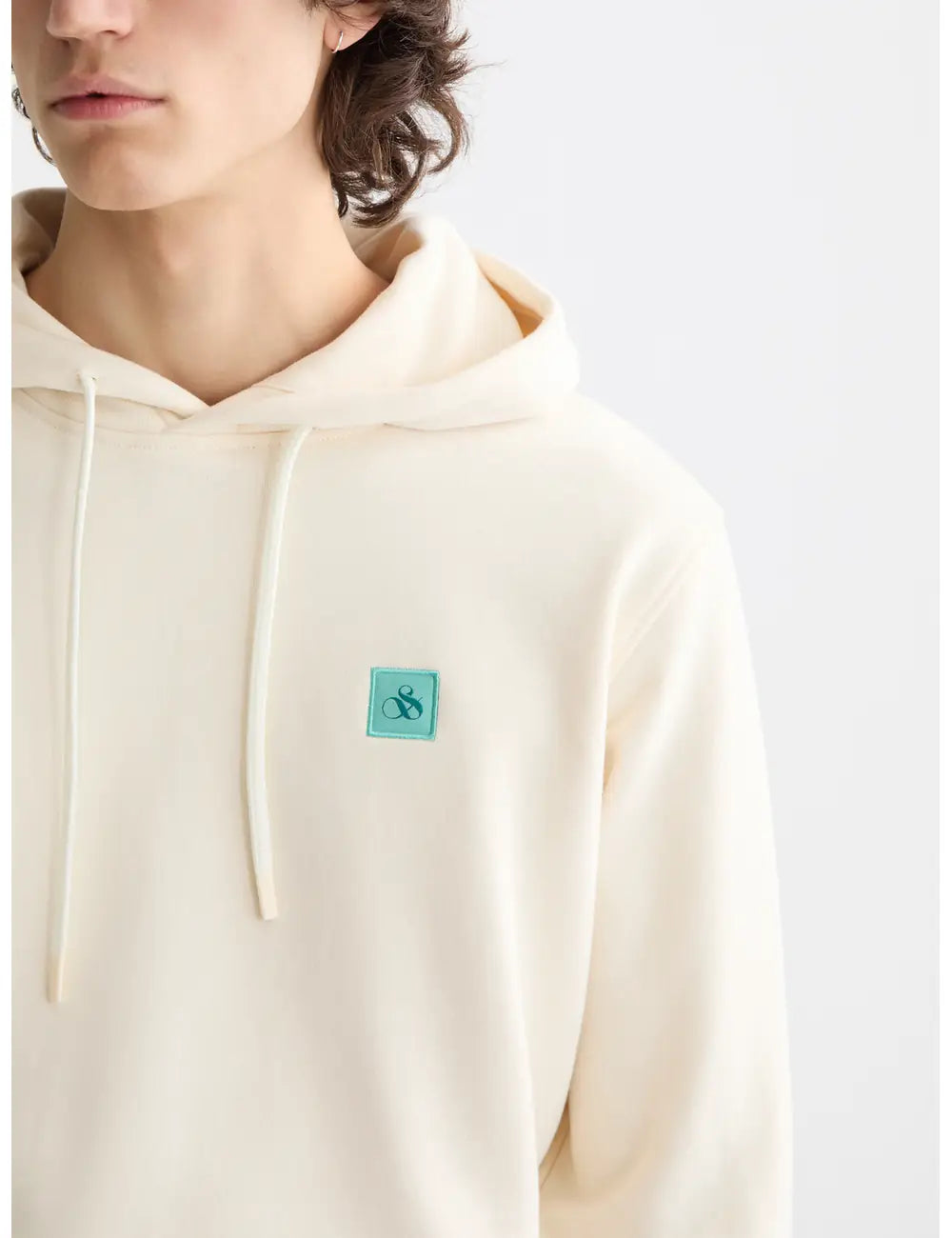 Logo Badge Hoodie close-up on model showing fit and detail by Scotch & Soda