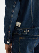denim-trucker-jacket-let-it-rain-750-years-celebration detail shot by Scotch & Soda