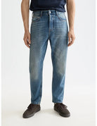 Loose Tapered Jean close-up on model showing fit and detail by Scotch & Soda
