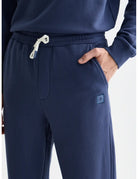 Seasonal Core Logo Badge Regular-fit Sweatpants detail shot of fabric and craftsmanship by Scotch & Soda