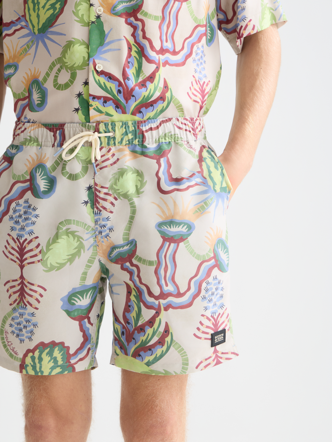 Printed mid-length swim shorts