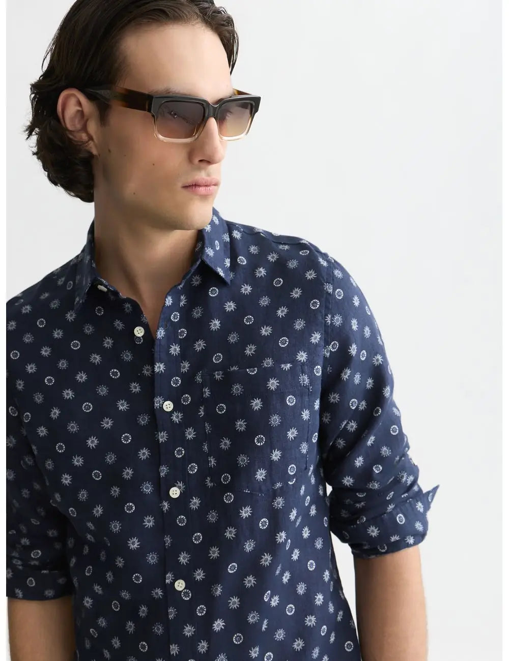 Man wearing a navy blue patterned shirt against a white background by Scotch & Soda