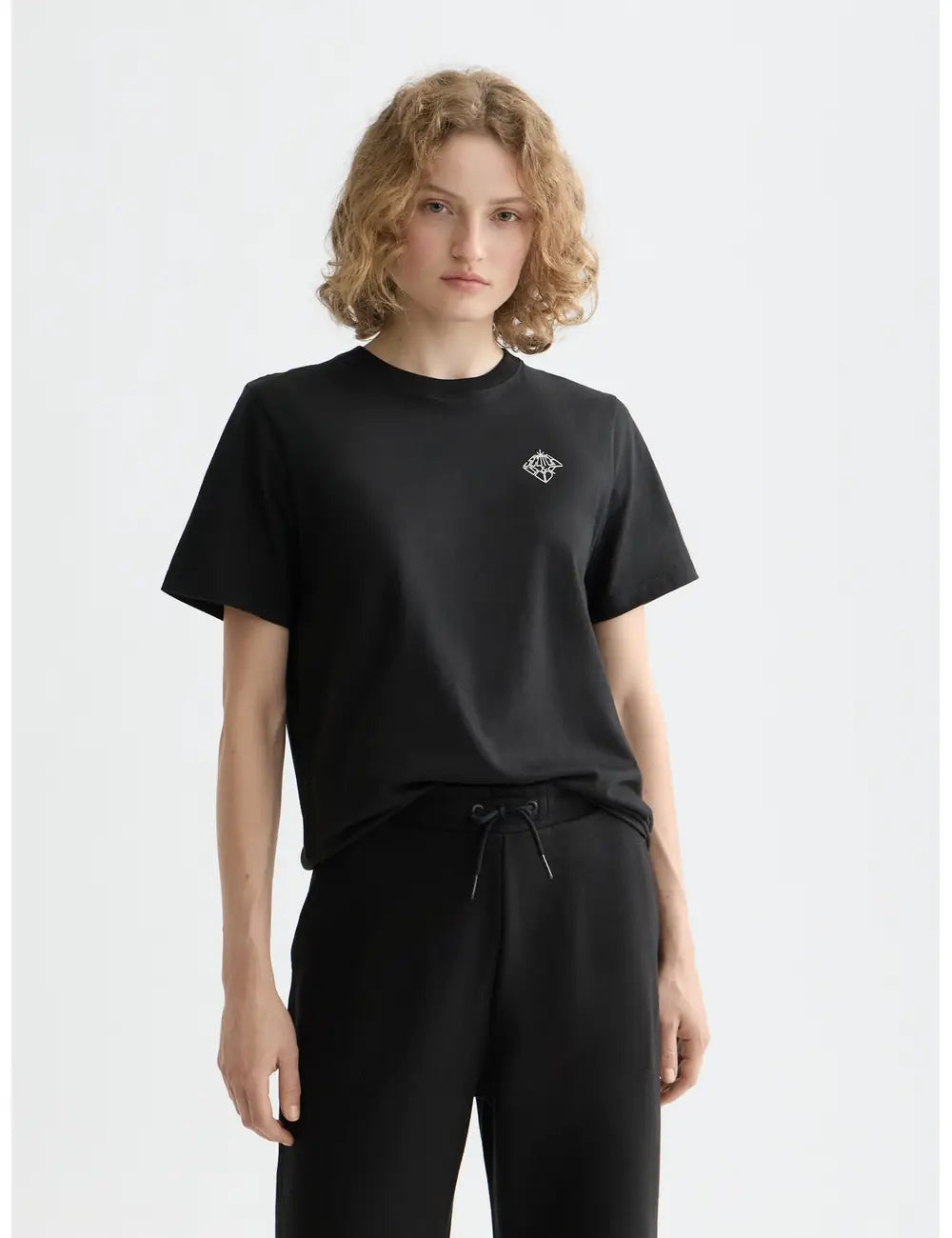 Black Core Chest Artwork Regular T-shirt close-up on model by Scotch & Soda