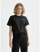 Black Core Chest Artwork Regular T-shirt close-up on model by Scotch & Soda