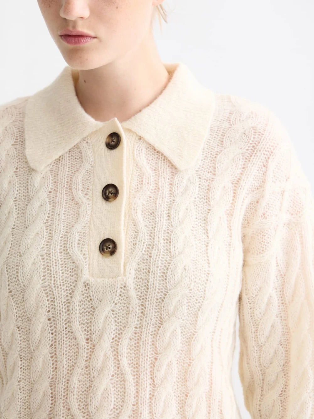 cable-stitch-polo-neck-pullover detail shot by Scotch & Soda