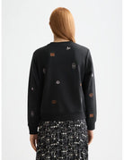 Mini Embroidery Sweatshirt detail shot showing fabric and craftsmanship by Scotch & Soda