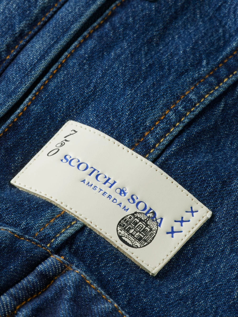 cropped-denim-jacket-let-it-rain-750-year-celebration detail shot by Scotch & Soda