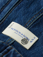 cropped-denim-jacket-let-it-rain-750-year-celebration detail shot by Scotch & Soda