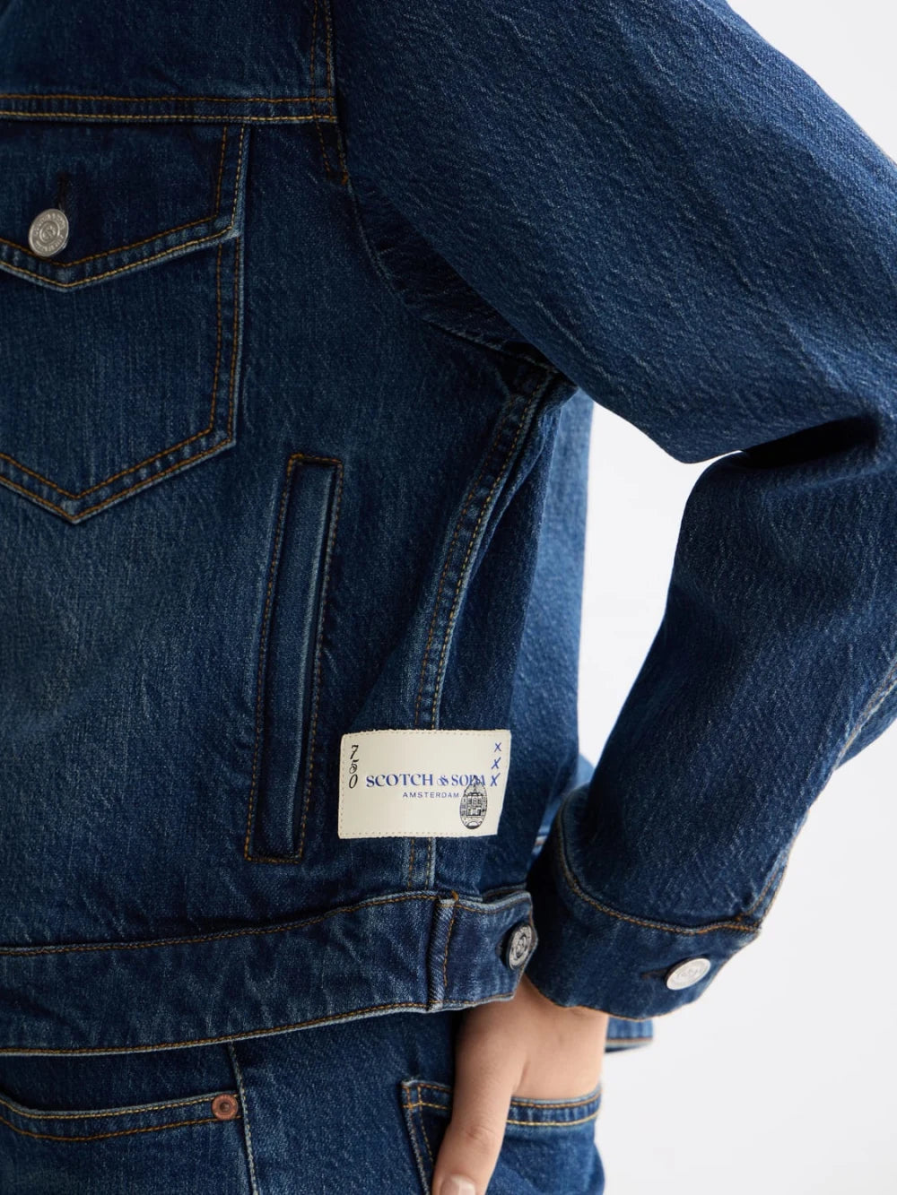 cropped-denim-jacket-let-it-rain-750-year-celebration detail shot by Scotch & Soda