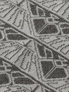 monogram-jacquard-knitted-trousers detail shot by Scotch & Soda