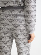 monogram-jacquard-knitted-trousers detail shot by Scotch & Soda