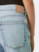 The Buzz Slim Boyfriend Jeans — Spring Lights (Blue/Grey) detail shot of fabric and craftsmanship by Scotch & Soda